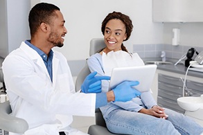 a patient speaking with her dentist about cosmetic dentistry