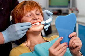 A woman getting her dental implants placed