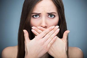 a woman anxious about her dental emergency 