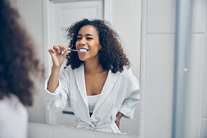 a patient brushing their teeth