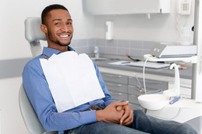 Male dental patient sitting and waiting for dentist