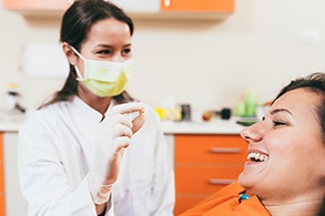 a patient smiling after a tooth extraction