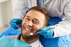 a close-up of a dental patient smiling