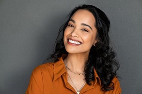 A patient smiling after receiving porcelain veneers in Salinas, CA