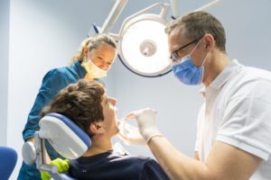 a young patient seeing an emergency dentist for his toothache