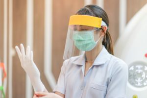 Salinas dentist wearing PPE in COVID-19 to prepare for appointment