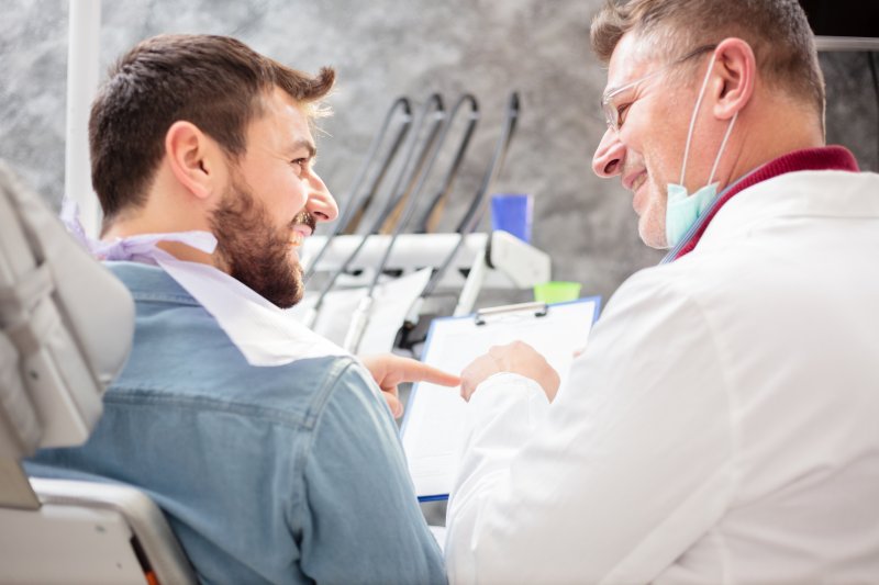 man consulting dentist in Salinas