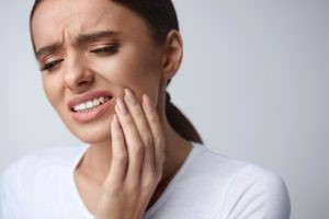 Woman with tooth sensitivity after whitening.