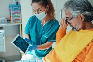 a patient asking questions during their dental implant consultation